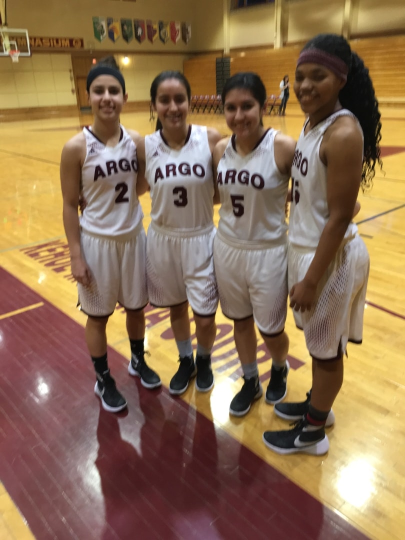 Four Argo players posing on the court