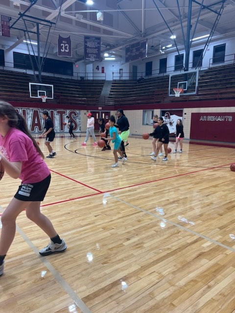 Players dribbling during practice in the Argonauts gym