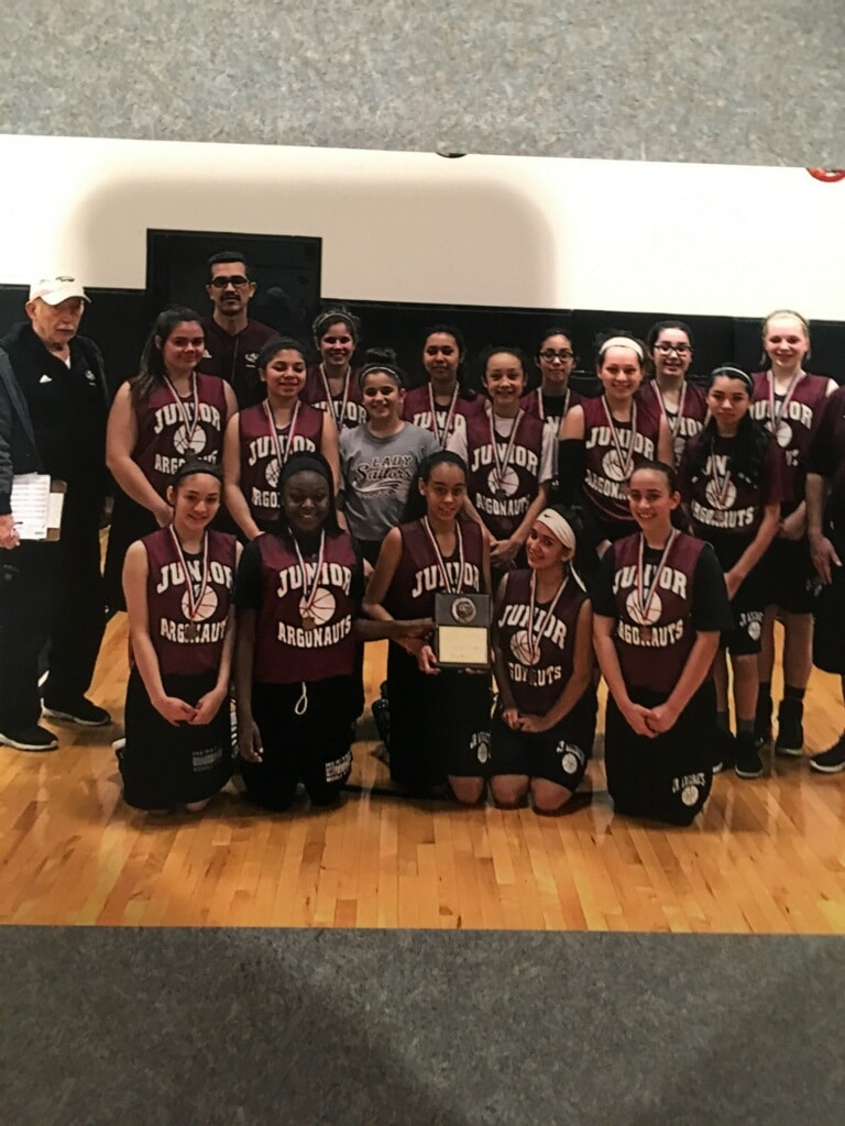 Junior Argonauts team with championship plaque and medals
